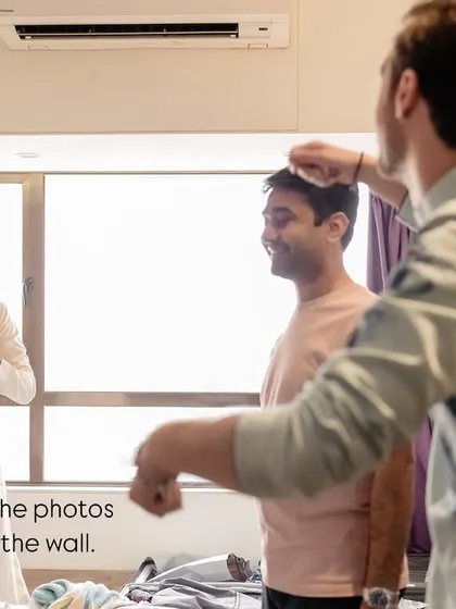 These aren't the photos you frame on the wall, but they are the ones that bring back the real memories. A friend helping the groom get ready is a perfect example of the unscripted support system on a wedding day.