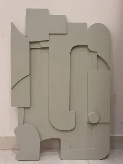 What do you see? This is an abstract sculptural piece on board, finished in a single, calming sage green. The layered shapes can be interpreted in many ways, making it a great conversation starter.