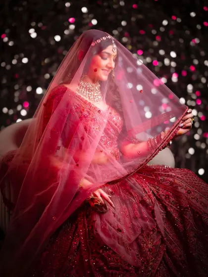 A dreamy and romantic shot from Jenisha's pre-wedding shoot. Her minimal makeup and beautiful red ensemble create a stunning visual.