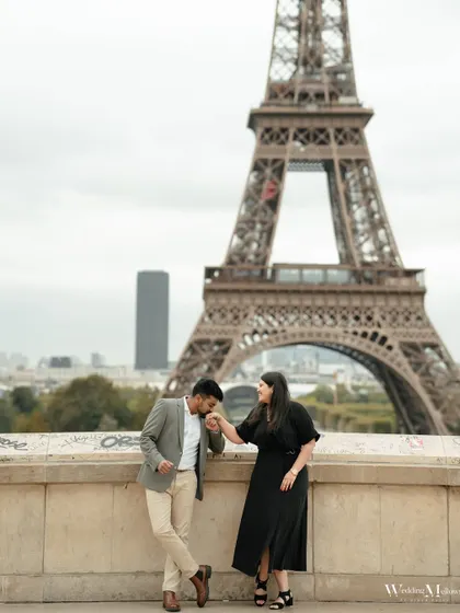 The iconic Eiffel Tower provides a stunning backdrop for this classic portrait of Varun and Aishwarya. We guide our couples into poses that feel natural and elegant.