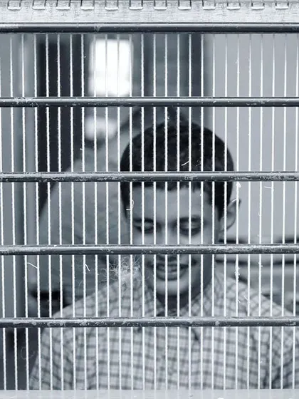 Shyness can be a beautiful and compelling character trait. This artistic black and white photo uses framing to tell a story of a quiet, introspective moment.