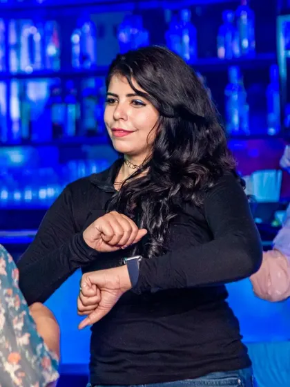 A guest checking the time, but the party is just getting started. The energy here keeps you dancing all night long.