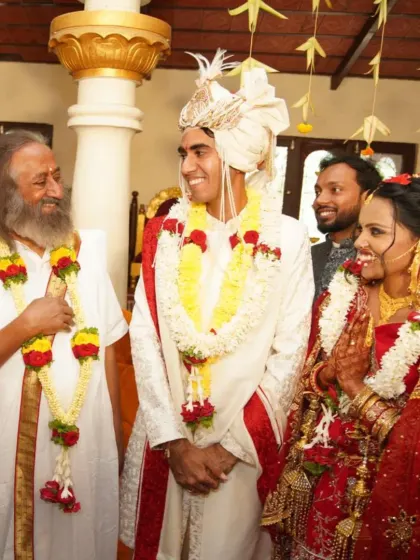 A moment of pure joy and grace as Gurudev blesses the newly married couple, Nikita and Pranav. Their smiles reflect the happiness of finding a spiritual companion for life.