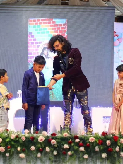 Children from the audience helping me out with a magic trick on stage. This kind of participation makes the show more exciting and gives the kids a chance to be the stars.