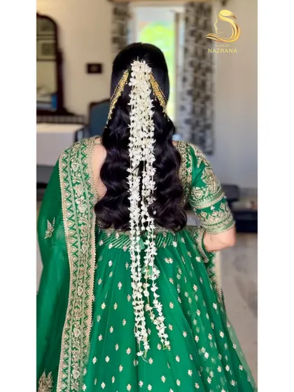 A detailed back view of the cascading gajra hairstyle, a beautiful fusion of traditional and modern styling.