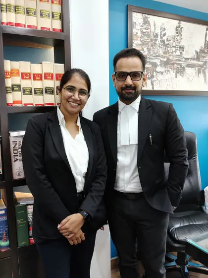 With a young colleague in my office library. I encourage young lawyers to continuously learn and use the resources available to them.