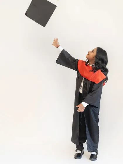 A proud moment for this kindergarten graduate. We believe in celebrating every milestone, big or small, and creating lasting memories for your family.