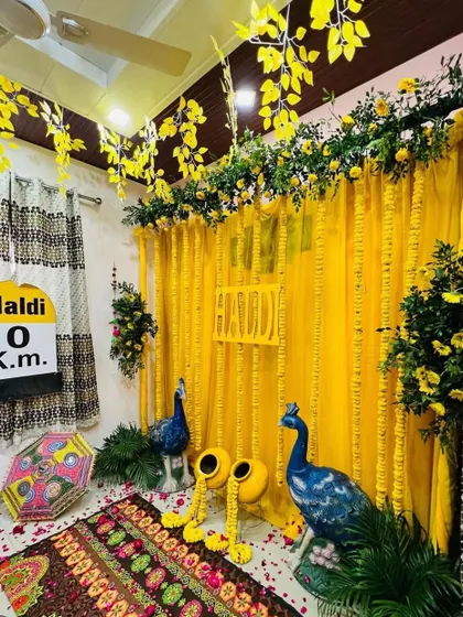 A fun and quirky addition to the home Haldi decor, with a "Haldi 0 Km" milestone sign, adding a personalized and humorous touch.