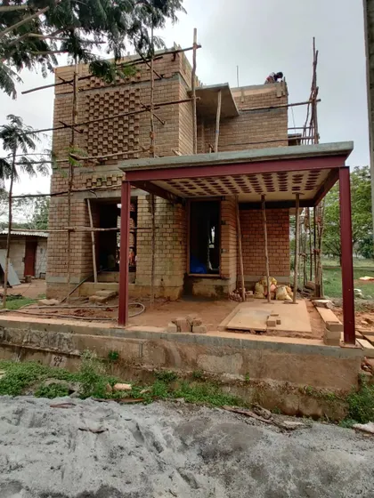 The exterior of a load-bearing brick house during the construction phase.