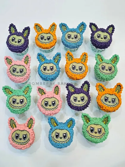 A colorful array of Labubu monster cupcakes, perfect for a trendy kids' birthday party. Each one has a unique color and a fun, furry buttercream texture.