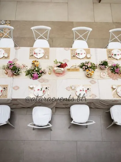 An aerial view of the long table setup at a Paris-themed baby shower. This shot highlights the beautiful symmetry and aettention to detail in the tablescape design.