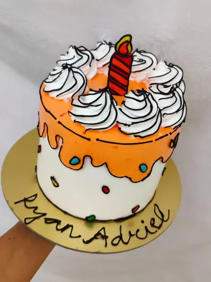 An orange comic cake with a cartoon candle. I can customize the colors to match any party theme.