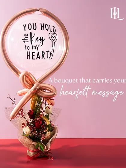 A bouquet that carries your heartfelt message. This unique arrangement features a "You Hold the Key to My Heart" balloon, making it a clear and beautiful declaration of love for Valentine's Day.