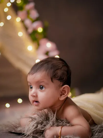 A world of wonder. This older baby is captivated by the lights and colors of the studio, and I love capturing that sense of awe.