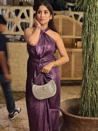 A solo shot of my purple metallic dress. I love the texture and the way it catches the light. It's the perfect statement dress for a night out.