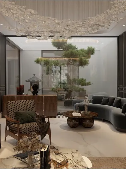 By using a curved sofa and opening the view to an internal courtyard, I designed this living space to feel both intimate and connected to nature. The soft fabrics and smooth marble floors create a sensory delight.