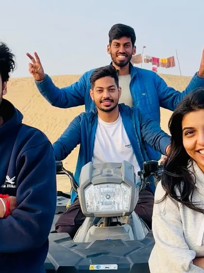 Posing for a photo on an ATV in the desert. We make sure you get plenty of opportunities for those perfect travel shots with your crew.