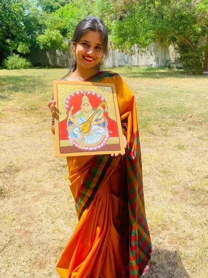 Another photo celebrating the completion of the traditional Mysore art piece.