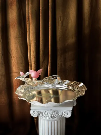 A tray this regal deserves a setting to match. My rose quartz bird tray, with its whimsical bird and floral accents, brings a touch of royalty and nature-inspired beauty to your serveware.