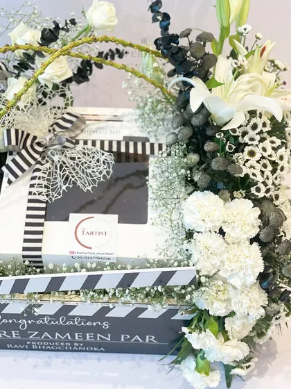 Another detail from the 'Sitaare Zameen Par' hamper, showing the delicious tarts from Tarte and the black and white striped ribbon that ties the movie theme together.