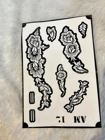 A delicate and flowing floral vine stencil. This design is perfect for creating an elegant pattern that trails along the natural curves of your hand or arm.