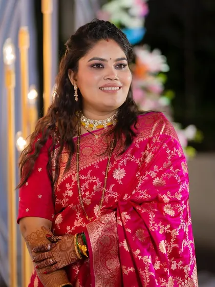 A happy and confident bride at her reception. The smokey eyes and dewy skin create a look that is both glamorous and elegant.