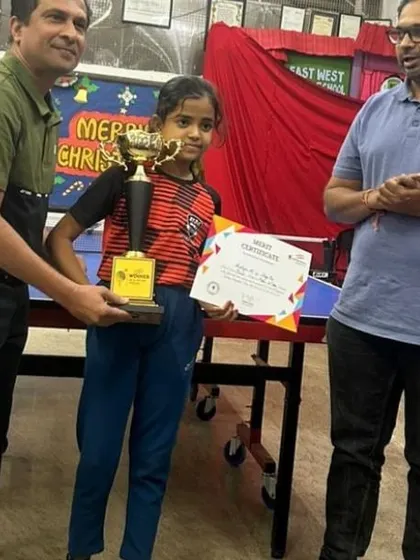 One of our talented young girls receiving her well-earned trophy. We provide a supportive environment for all players to excel.
