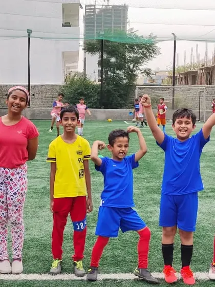 Our happy monkeys. A group of our youngest players posing with big smiles and fun poses after a training session. This is what it's all about.