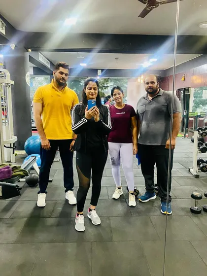 A mirror selfie with some of my dedicated clients. We all work hard to achieve our fitness goals together.