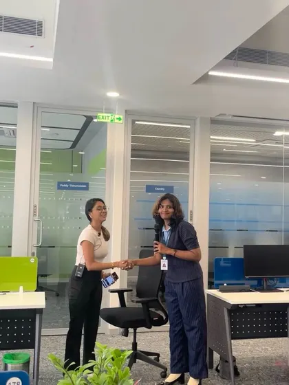 A moment of appreciation and connection with a participant after a rewarding desk yoga session.