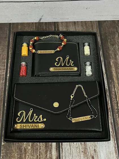 The same Bhai-Bhabhi combo, shown here in a sleek black leather finish with "Mr." and "Mrs." name tags.