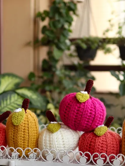 A whole patch of my cheerful crochet pumpkins, in all their colourful glory.
