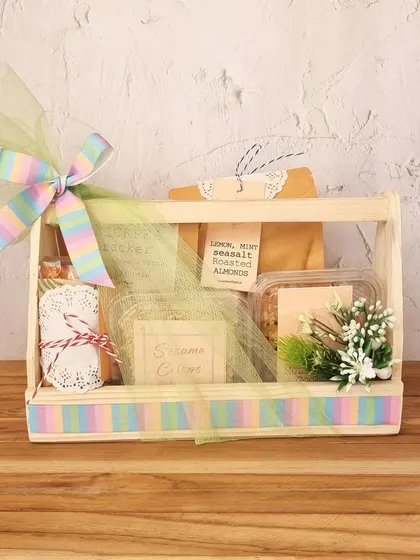 A beautiful pastel-themed hamper in a wooden crate. It's a perfect gift for any occasion, filled with a mix of our popular snacks like Lemon Mint Seasalt Roasted Almonds.