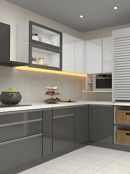 High-gloss grey cabinets give this L-shaped kitchen a sophisticated, urban look. We included practical storage solutions like a tall unit with a louvered door and open wicker basket drawers for easy access to vegetables or linens.