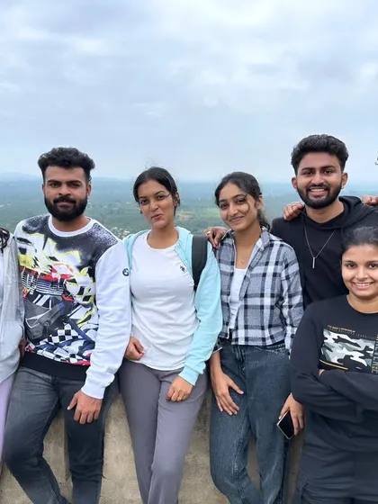 Taking a break to enjoy the view from the top. The panoramic landscapes are one of the biggest rewards of a weekend trek.
