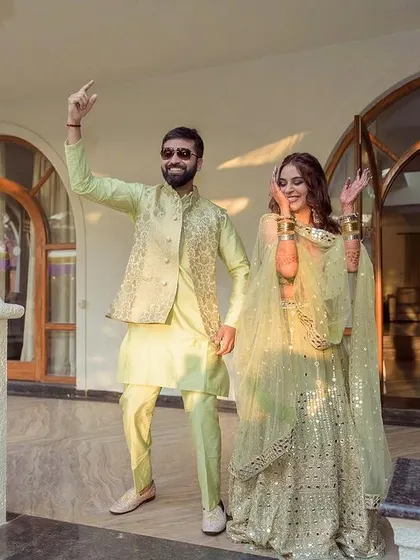 The couple making a cool, fun entrance to their Mehendi or Sangeet party in Goa.