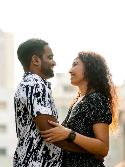 A happy, candid moment from the couple's urban pre-wedding shoot.
