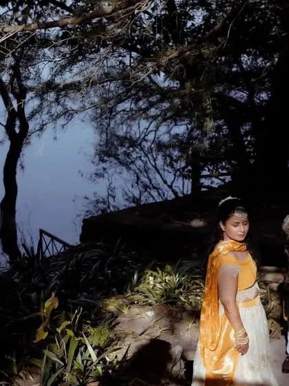 Another perspective of the lakeside Haldi shoot, capturing the serene and picturesque setting of their celebration.