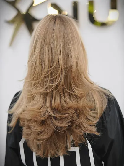 Beautiful, classic layers on blonde hair. This cut is timeless and perfect for adding body to long hair.