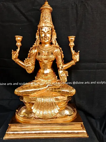 Another angle of the golden Lakshmi sculpture, focusing on her benevolent expression and the Varada mudra, the gesture of granting boons.