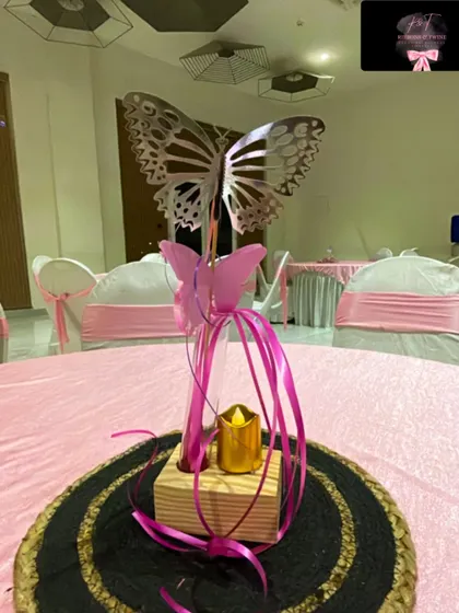 An identical shot of the butterfly-themed table centerpiece.