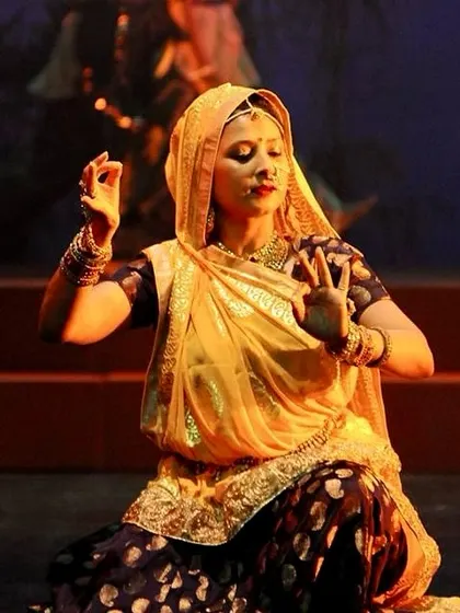 A portrait of Guru Maa Smt. Ruby Mishra in a moment of deep 'abhinaya' during a performance.