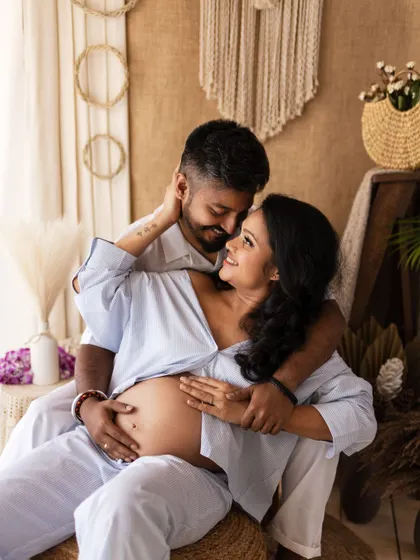 Another beautiful, intimate pose from a relaxed maternity session, capturing the couple's deep connection and excitement.