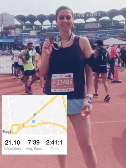 A client celebrating her half-marathon finish. My programs help runners and endurance athletes build the strength needed to perform better and feel stronger during their races.