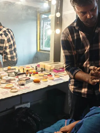 Getting ready backstage! A makeup artist prepares one of our young performers, showing a glimpse of the professional experience they get.