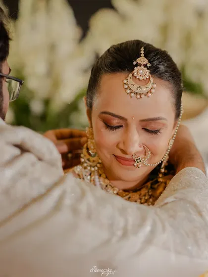 A tender moment between the bride and groom during their Gujarati wedding ceremony.