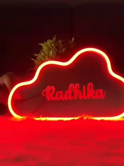 I also offer neon signs in bold colors like this vibrant red one, customized with the name "Radhika."