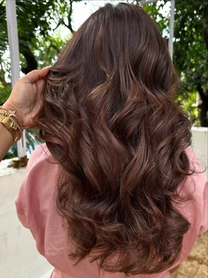 Another angle showcasing the rich tones and healthy, glossy finish of this hair transformation.