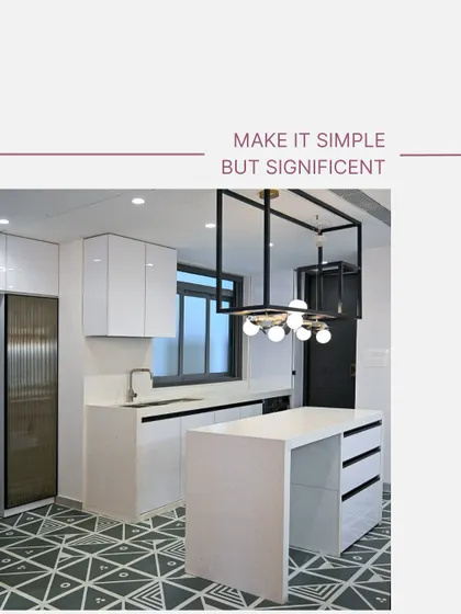 "Make it simple but significant." This image shows a minimalist island kitchen with black and white geometric floor tiles, handleless white cabinets, and a striking overhead lighting fixture.
