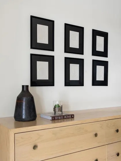 A beautiful light oak dresser with minimalist knob handles, custom-made for the Weespaces neutral chic home.